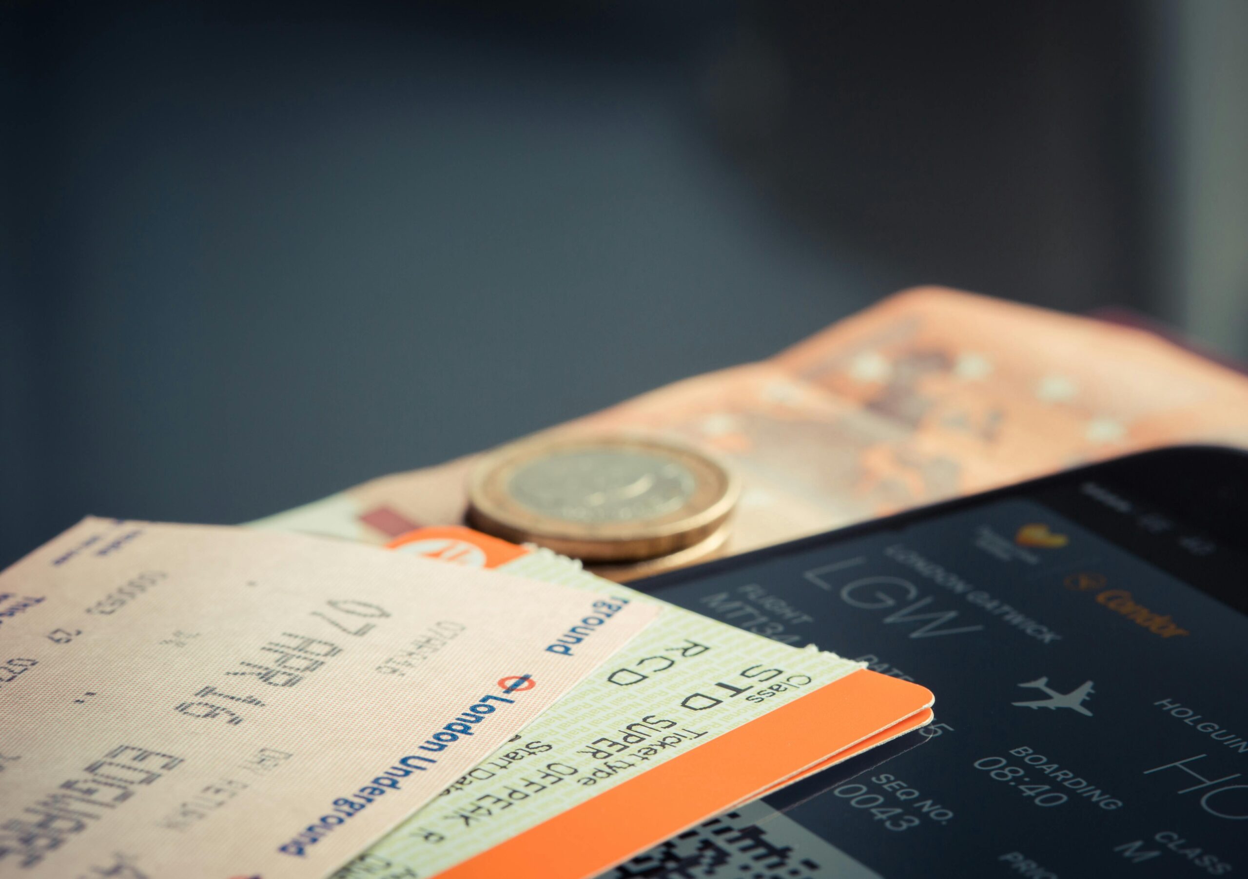 Airline Booking travel challenges represented by tickets and money on table